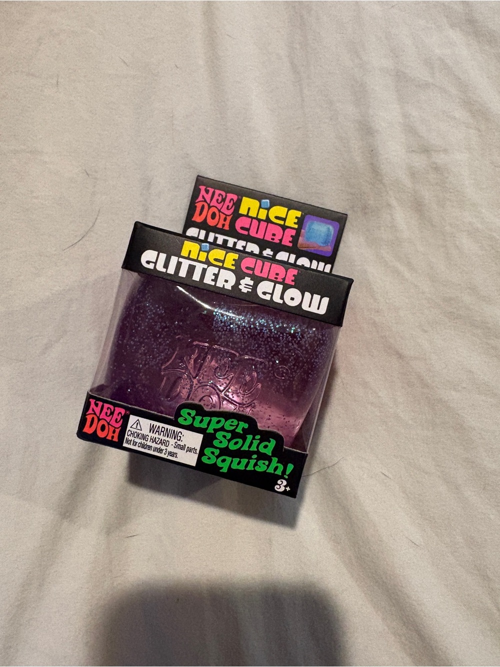 Needoh Nice Cube Glitter & Glow Super Solid Squish - Purple